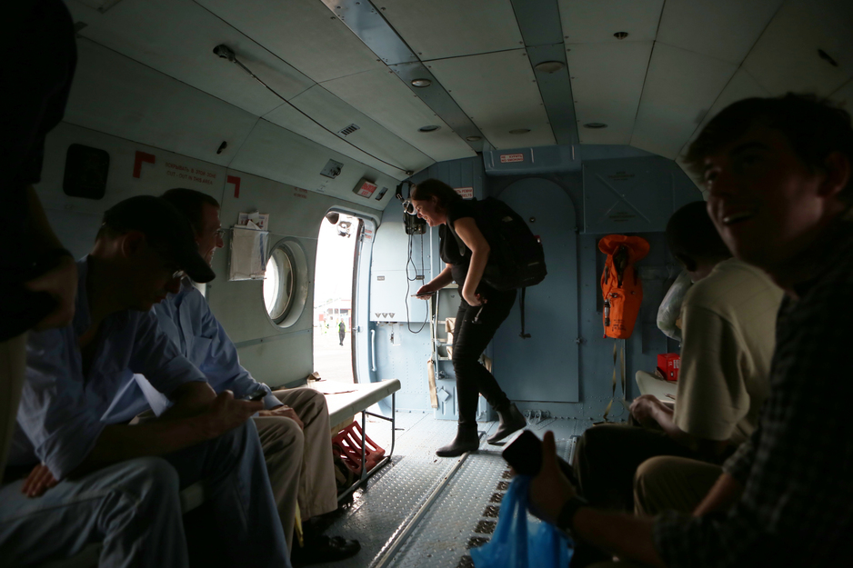 Sheila Davis departs helicopter during Ebola response in Liberia