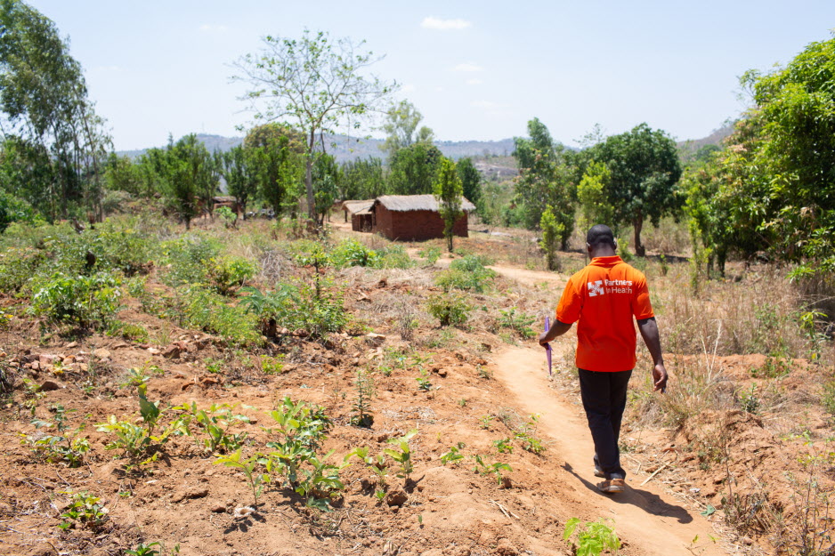 CHW Program Officer Benson Chabwera leaves a home visit in Neno, Malawi, in September 2018