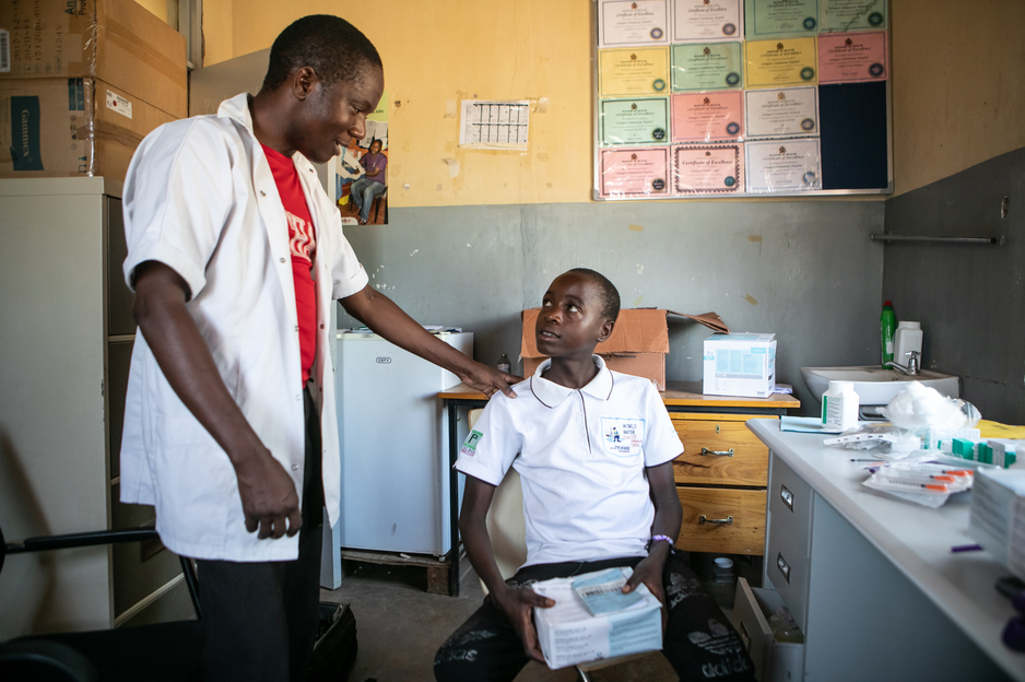 NCD nurse Victor Kaphaso advises Kerefasi about his insulin 