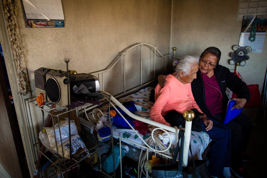 Community health representative checks on an elderly patient on Navajo Nation