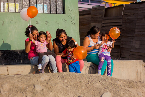 Mothers and their children celebrate graduation from the CASITA program.