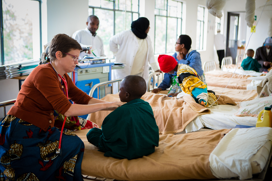 Dr. Grace Dugan checks a patient in the pediatric ward at Butaro District Hospital.