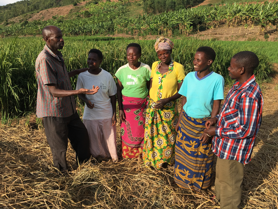 Florenti Rukiriza helps parents with rice farming to supplement their food and income