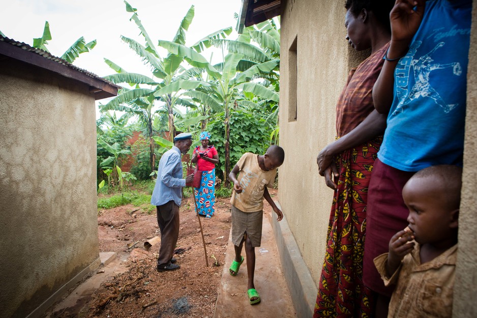 A community health worker visits a family at home in Rwanda