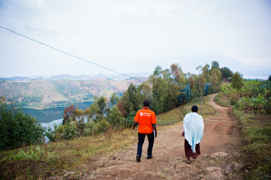 Staff for PIH in Rwanda walk to the home of a patient in Burera District, in September 2016