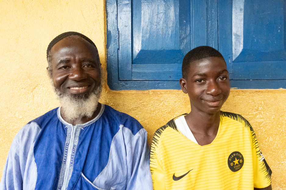 Mondeh and his father at home in Sierra Leone