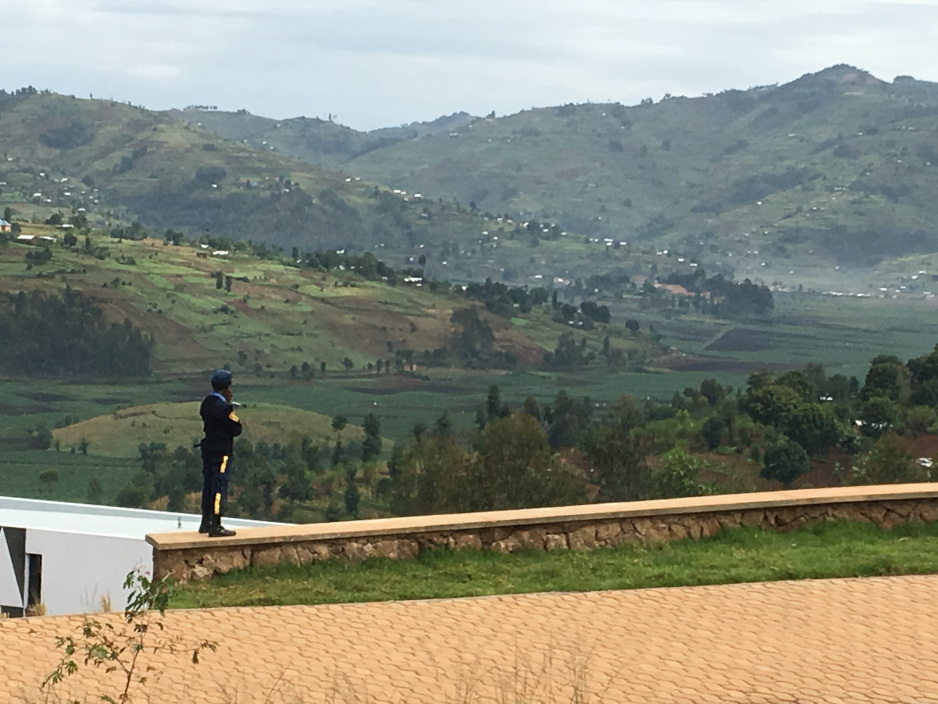 A security guard overlooks surrounding hillsides at the University of Global Health Equity in northern Rwanda