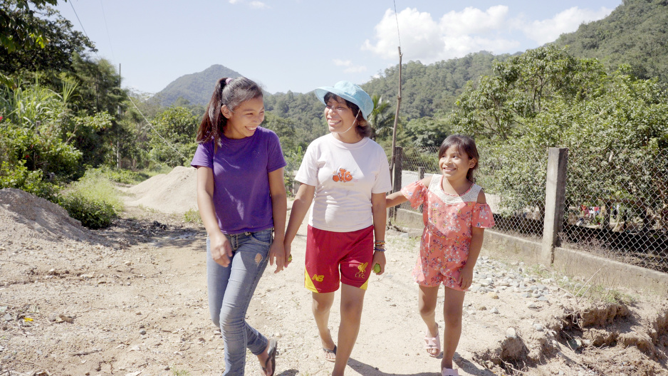 Ariadna, center, walks with her sisters, Citlali and Hanna, from the family's coffee farm in Plan de la Libertad. Photo by Caitlin Kleiboer / PIH.