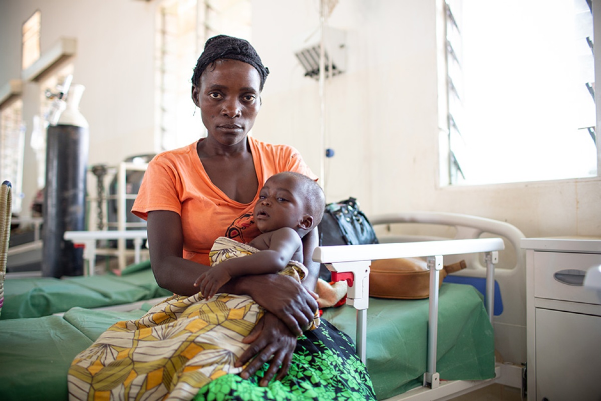 Chisomo Tigone, 7 months, sits with his mother, Flora, during his treatment for severe malaria.