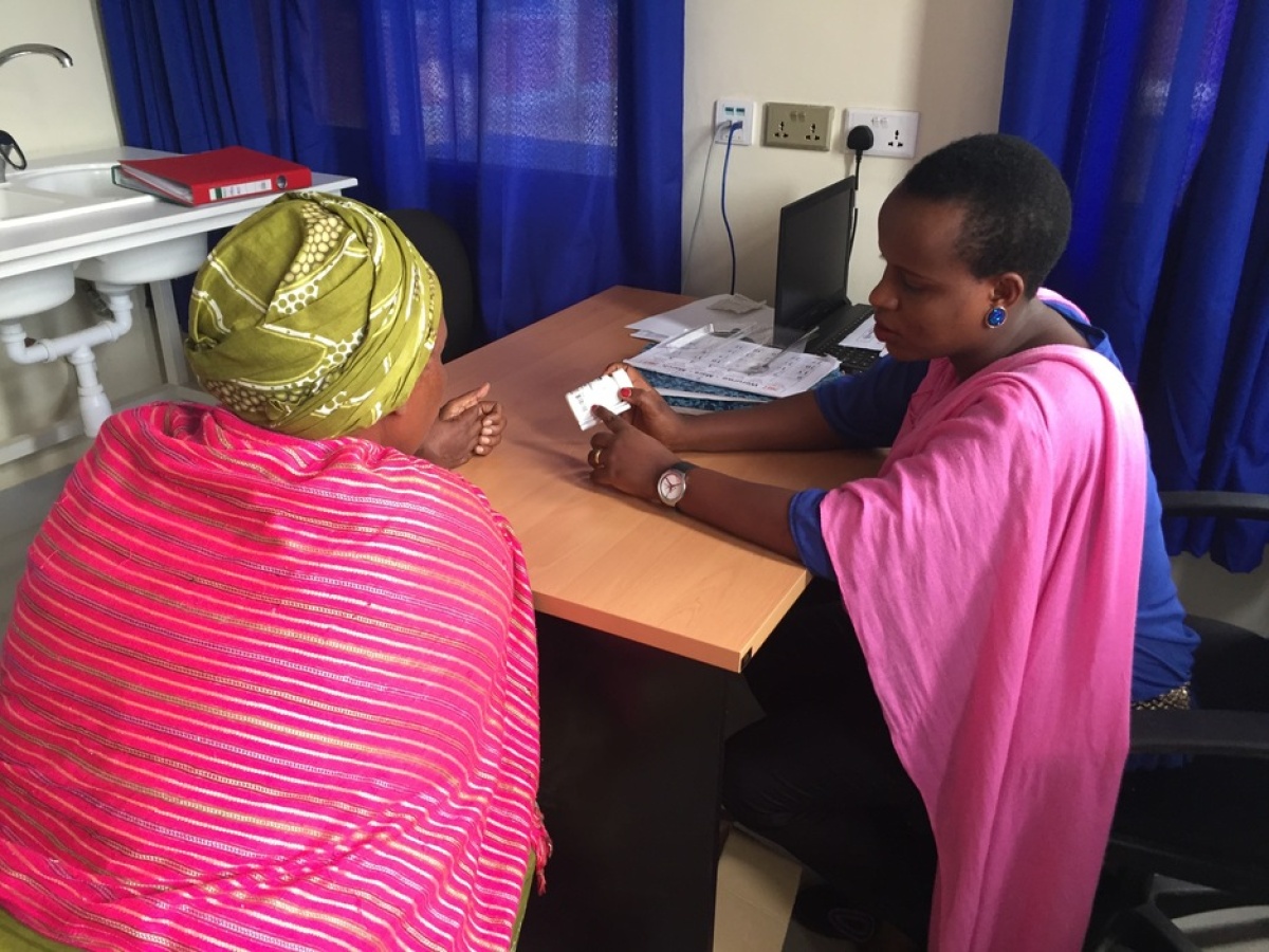 Alphonsine Imanishimwe, coordinator of the 2017 hepatitis C trial in Rwanda, counsels a new patient