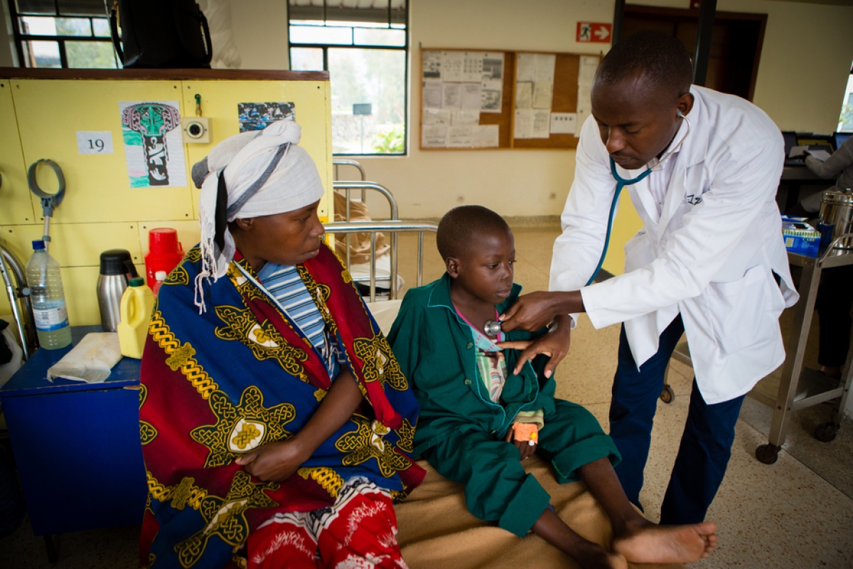Dr. Cyprien Shyirambere examines 6-year-old boy at the Butaro Cancer Center of Excellence
