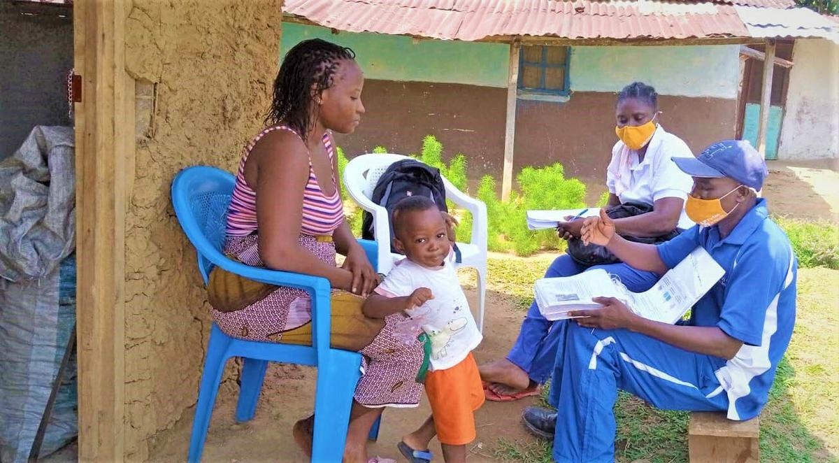 community health workers meet with patients