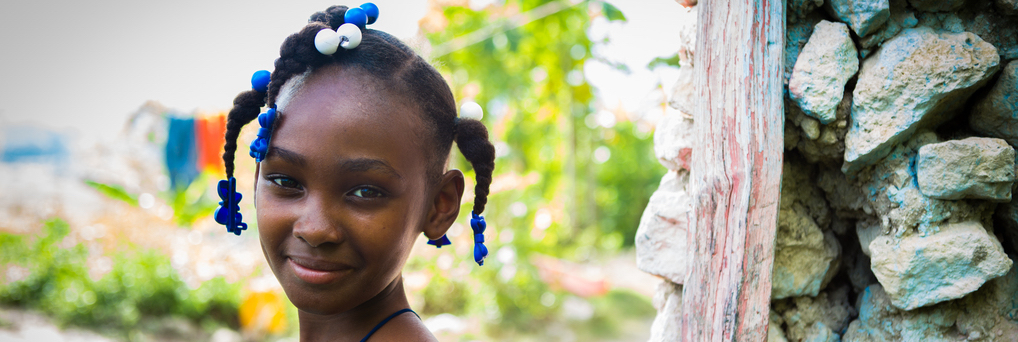 Judedana Déliaza, 11, poses outside her home in Boucan Carre, Haiti.