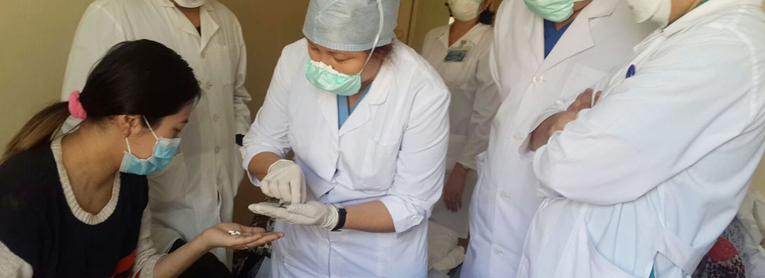 Doctors observing a patient