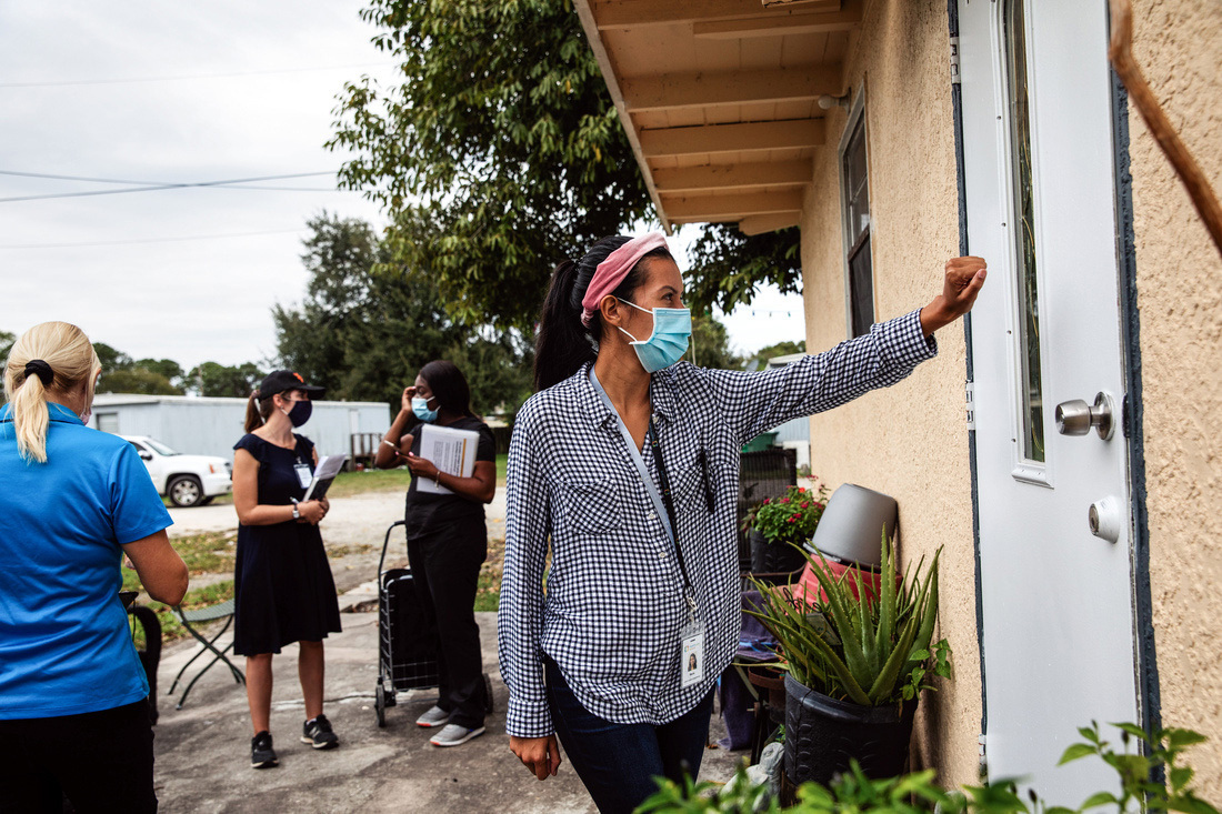 community health worker visits homes in Immokalee, Florida, to educate on COVID-19