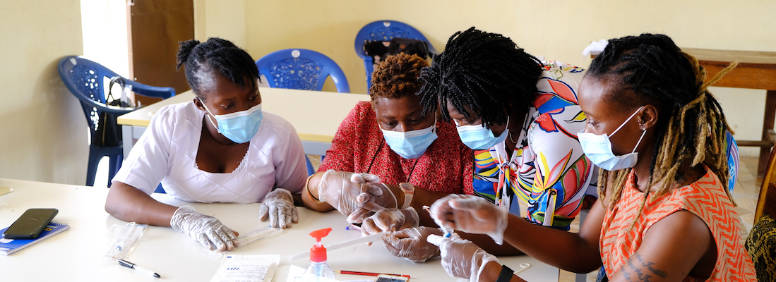 Nurses and midwives from Koidu Government Hospital take part in a family planning training (funded by GAC). They practice inserting copper IUDs using a rubber model of the uterus.