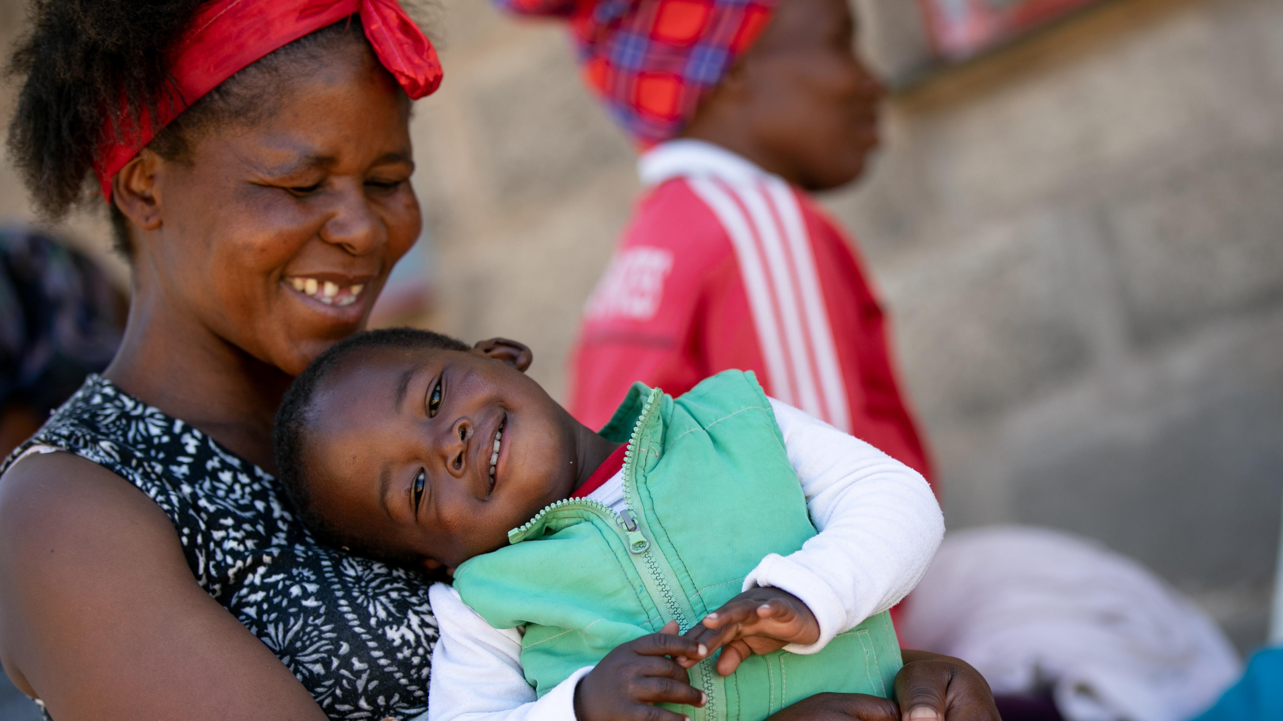 A mother and her son attend a maternal health clinic in Lesotho