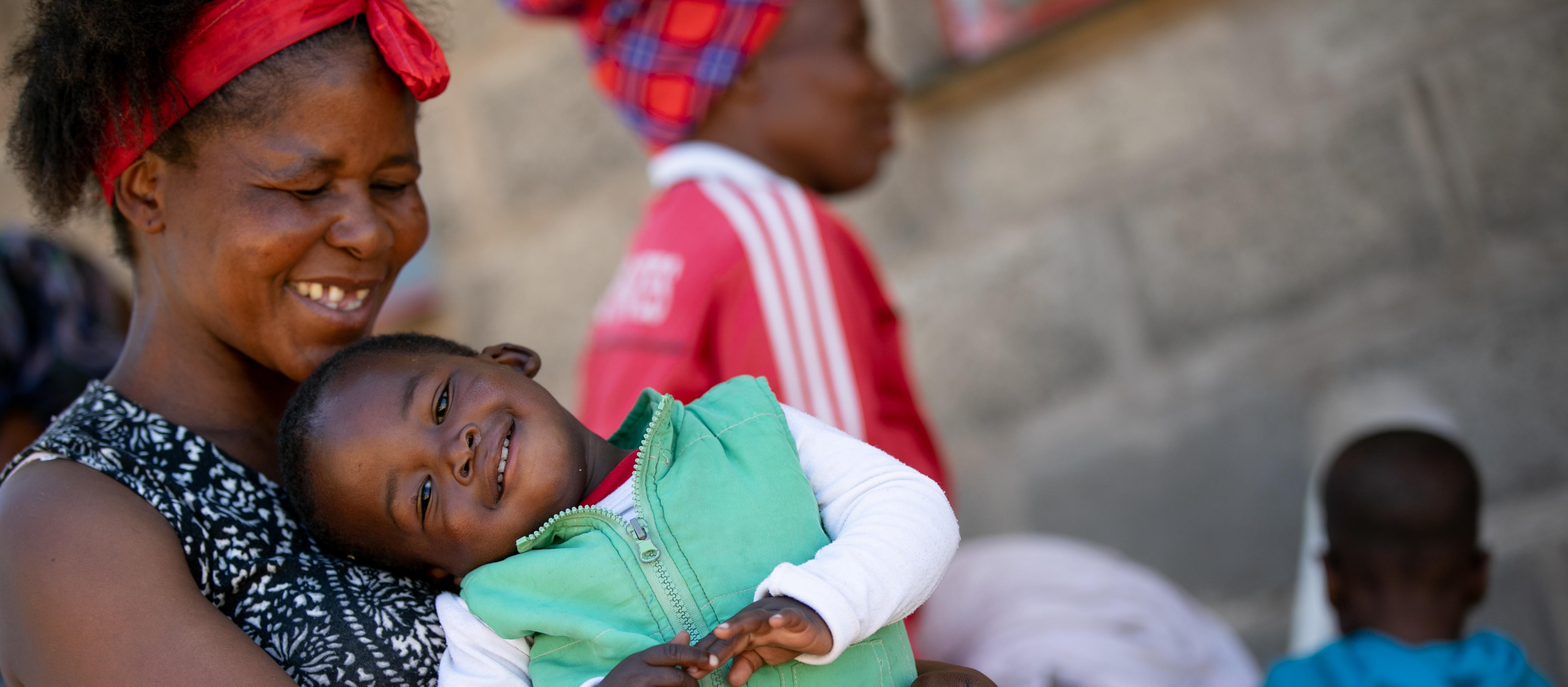 A mother and her son attend a maternal health clinic in Lesotho
