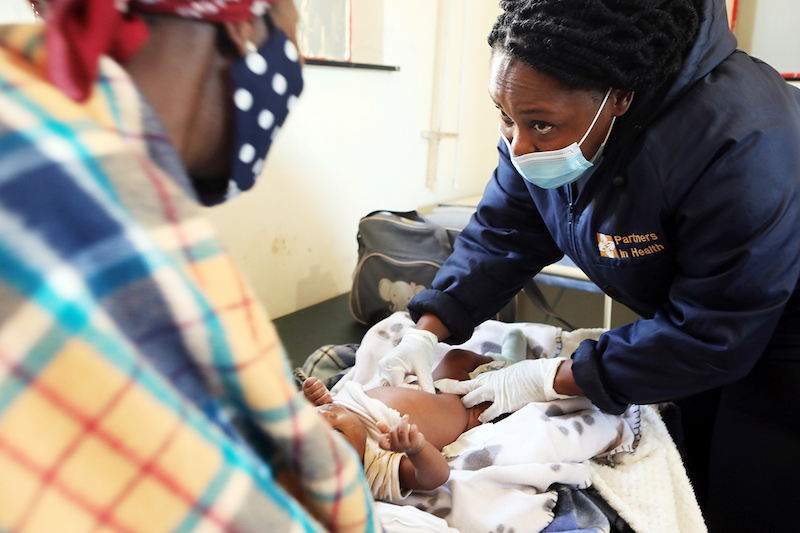 Nurse Maloney Ts’oeunyane conducts a pediatric checkup for Maseleta Mosotho’s six-week-old son Thabeleng at PIH's Nkau Health Center in Mohale's Hoek District, Lesotho.