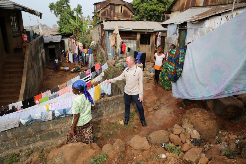 Paul Farmer with an Ebola survivor in Sierra Leone
