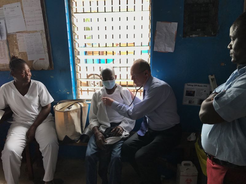 Paul Farmer examines a patient in Liberia