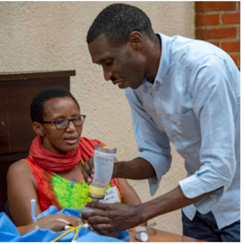 Andre Ndayambaje trains a midwife in newborn care