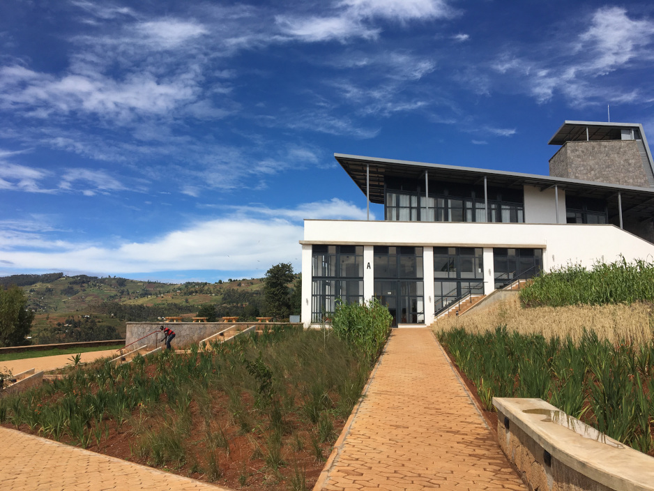 A main building on the UGHE campus, surrounded by Butaro hills
