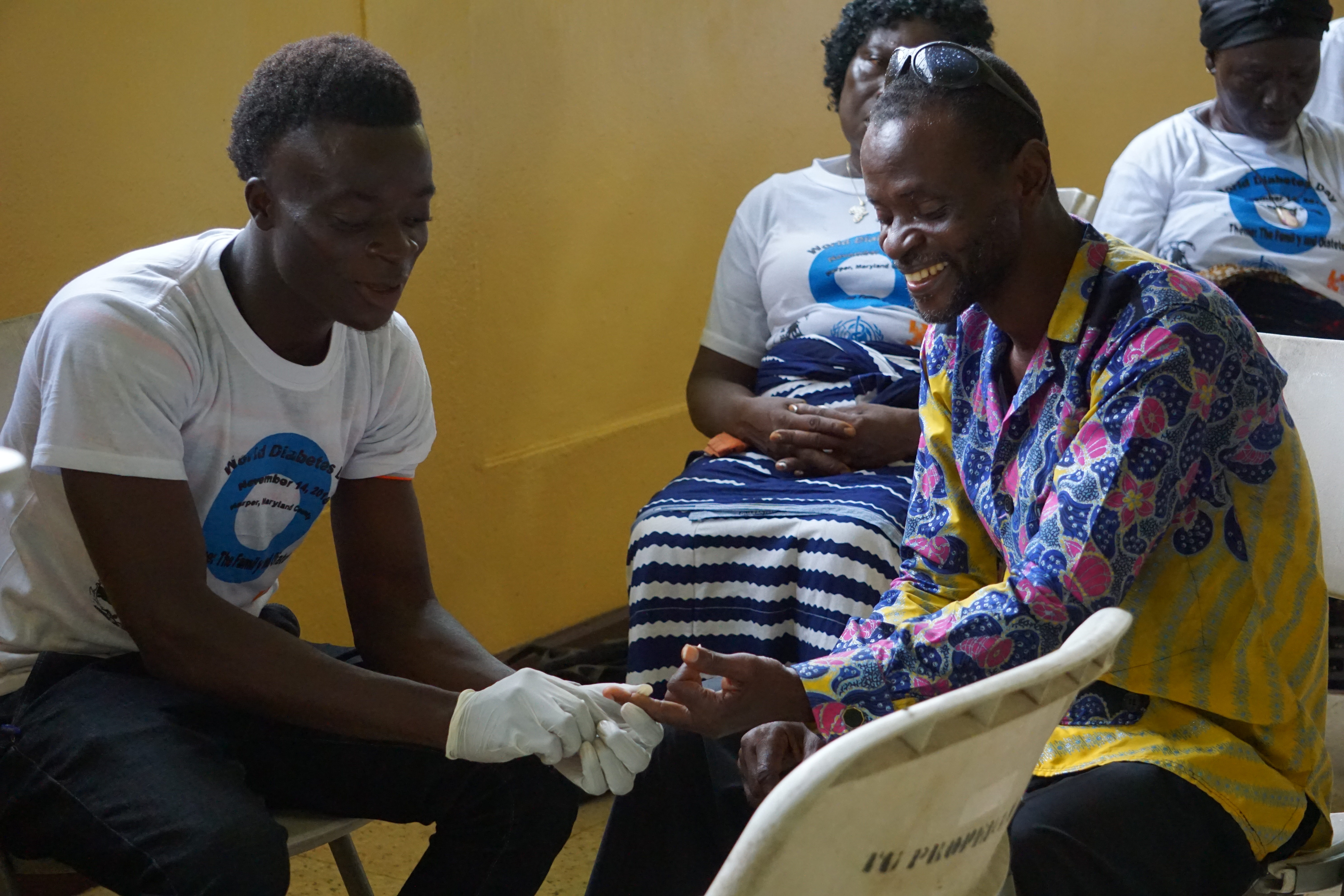 Diabetes patient in Liberia undergoes a blood sugar check