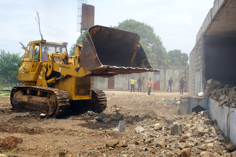 A bulldozer clears land on the Maternal Center of Excellence site 