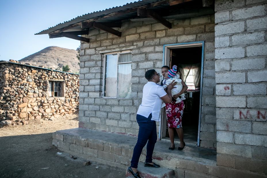 Rorisang Lerotholi, nurse-in-charge at PIH-supported Nkau Health Center in Mohale’s Hoek District, Lesotho, makes a home visit to 19-year-old Moselantja Ntaote and her 3-month-old son, Atlehang.