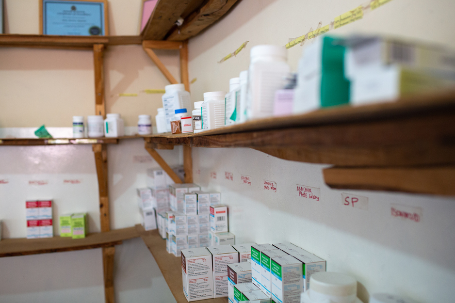 medication stocked on shelves in a rural pharmacy in Malawi