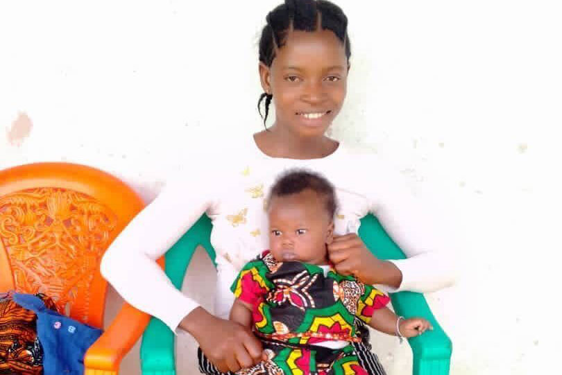 A mother visiting a clinic with her child