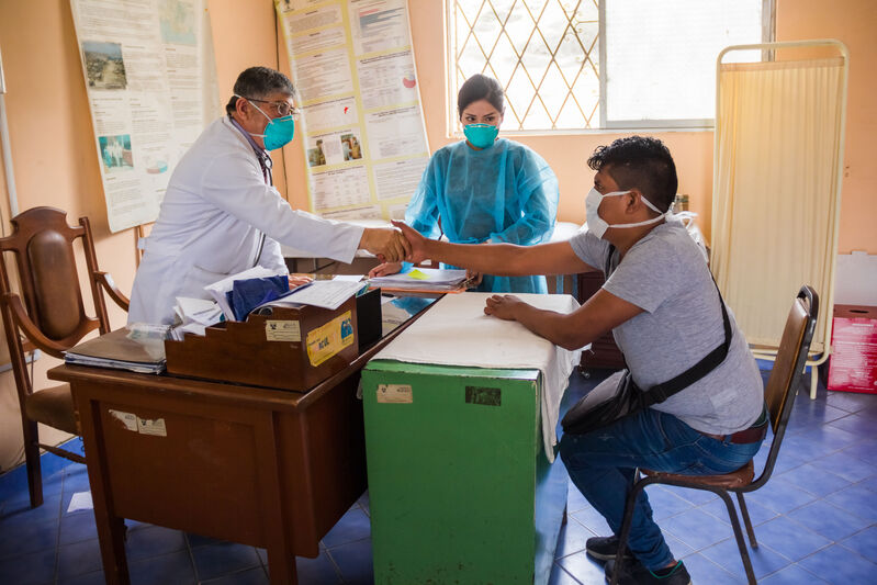TB doctor in Peru shakes hands with a patient