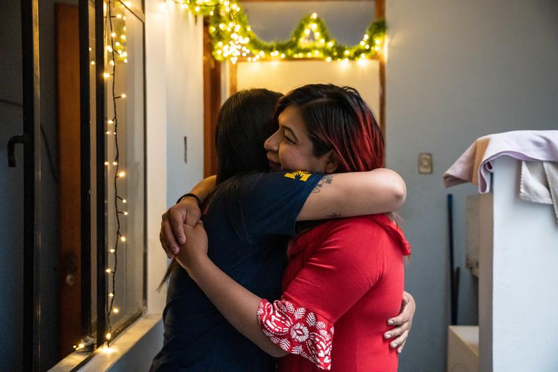 Dr. Maria Fernanda Amézquita Olivares, a psychologist with Socios En Salud, and Brenda Mijahuanca embrace. Photo by Diego Diaz Catire / Partners In Health.