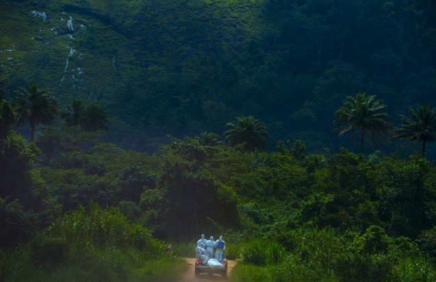 Care workers in a vehicle on a dirt road