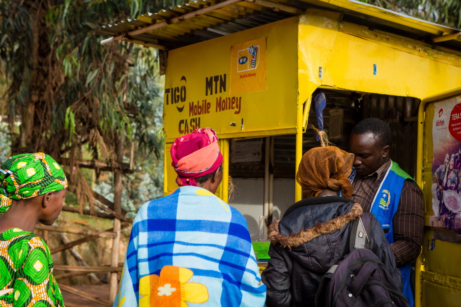 Bizinde Elyse helps customers at his stall in March 2017