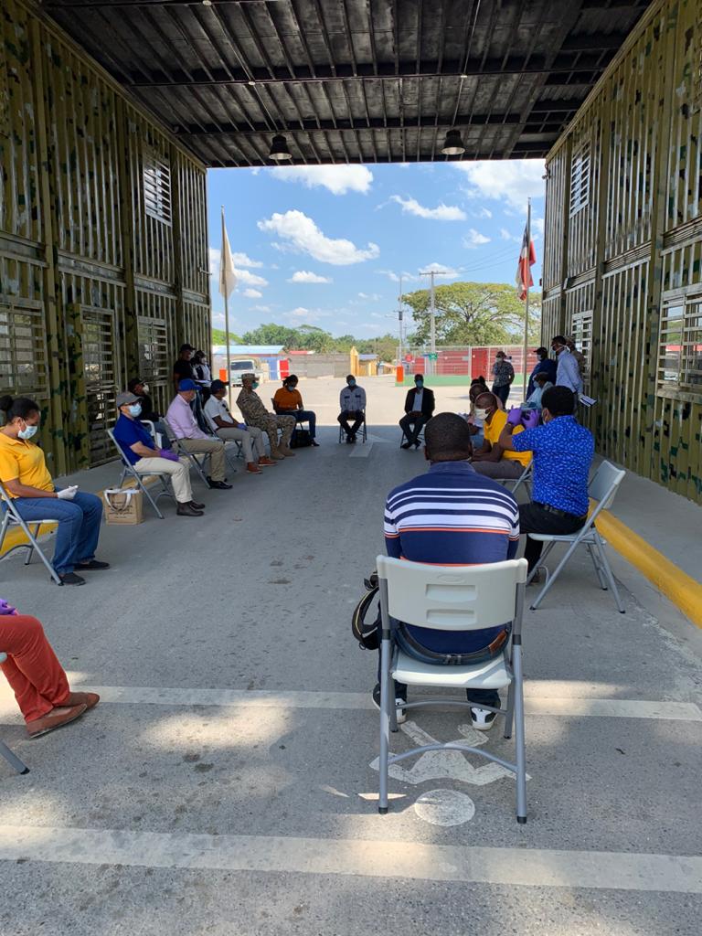 PIH staff in Haiti meet at the border with official from the Dominican Republic