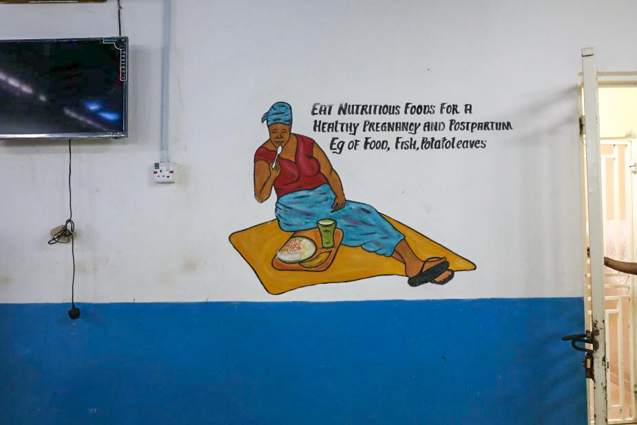 A healthy diet, encouraged by a mural in the KGH maternity ward, is key to a safe pregnancy--but is often unattainable for women in Kono District.