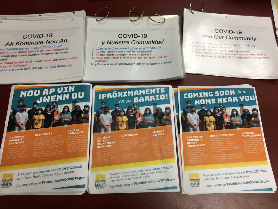 Informational flyers about COVID-19 and social support resources available for people in Immokalee.