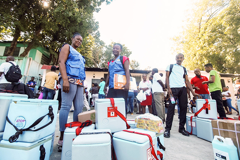 Boxes of cholera vaccines are prepared for distribution at various sites and communities. Melissa Jeanty/PIH