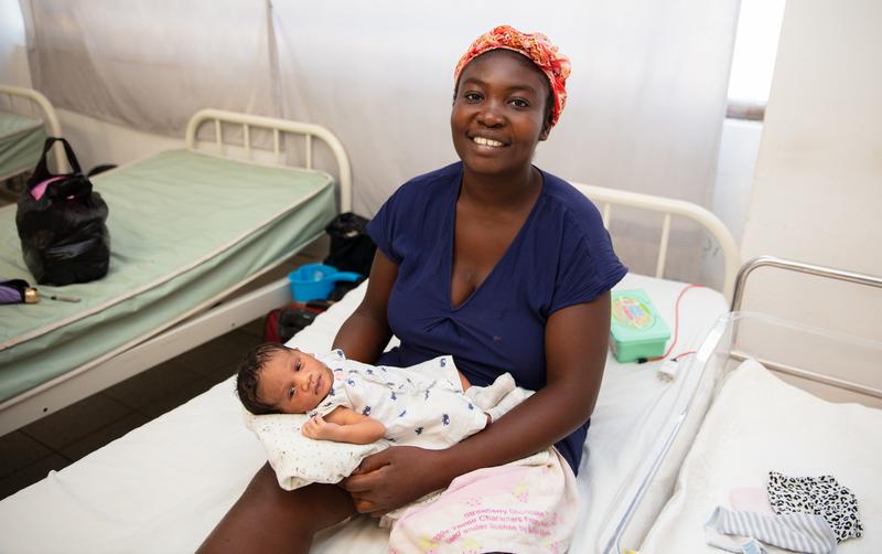Margarette St. Fort (mother with newborn baby), 31 years old. This is her 3rd child. She walked from Thomonde to Mirebalais to give birth. She is recovering in the post-partum department. Hopital Universitaire de Mirebalais (HUM) in Mirebalais, Haiti, on March 23, 2023. Photos by Nadia Todres for PIH.