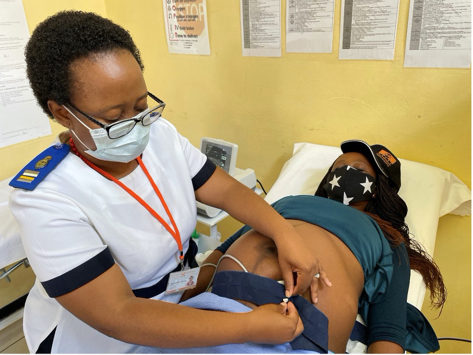 Palesa Khomongoe uses the CTG machine to monitor a baby's heartbeat