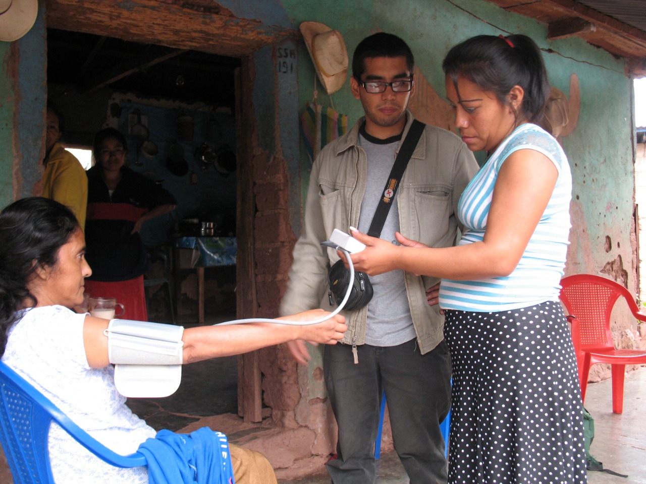 In this picture, Compañeros En Salud Co-founder Dr. Hugo Flores accompanies a community health worker on a house call in the community of Matasano in 2014. 