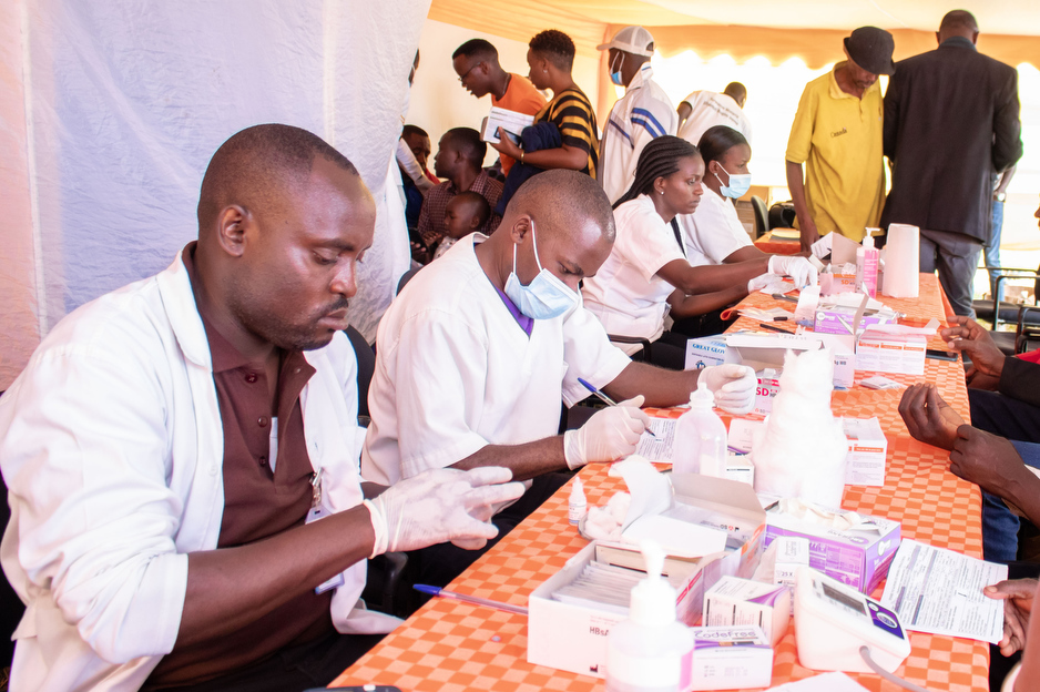 Health workers screen patients for hepatitis