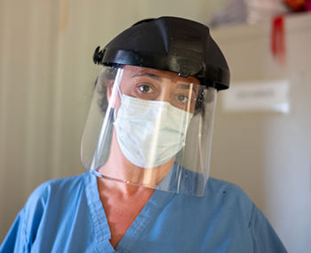 Dr. Marta Lado masks up at 34 Military Hospital in Freetown, Sierra Leone