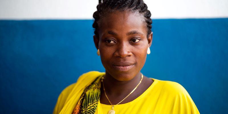 pregnant mother awaiting care at rural clinic in Sierra Leone