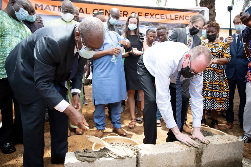 Paul Farmer helps lay the first bricks to the Maternal Center of Excellence in Sierra Leone