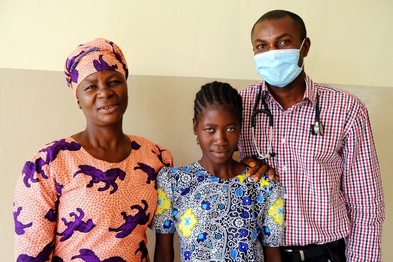 doctor poses with mother and teen daughter who was in his care 