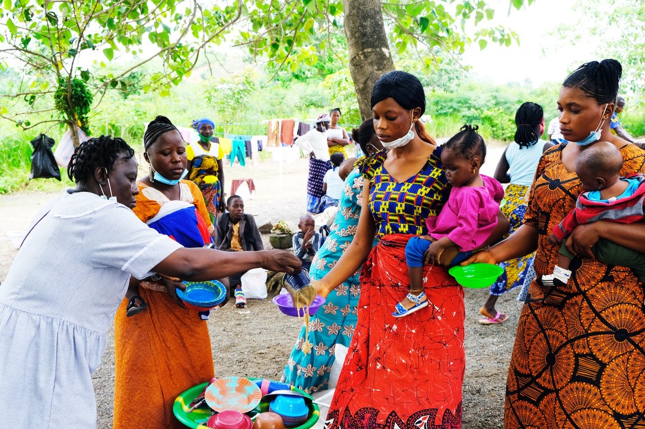 Mothers served Bennimix as part of PIH Sierra Leone's malnutrition program