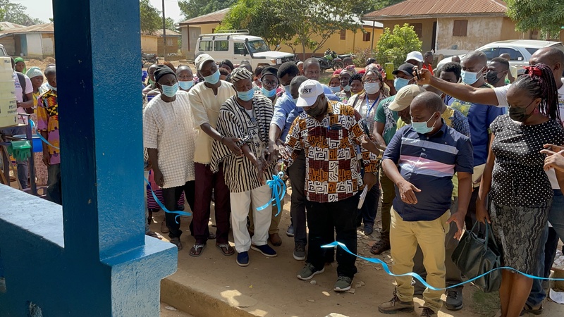 Staff cutting a ribbon to mark the official reopening of Kombayendeh Community Health center